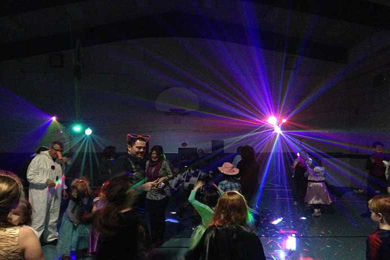 School Light Show, Hamilton DJ, Family Dance with parents and children dancing. Costume contest for favourite movie character. Amazing light show in background. Taken in Hamilton Ontario.